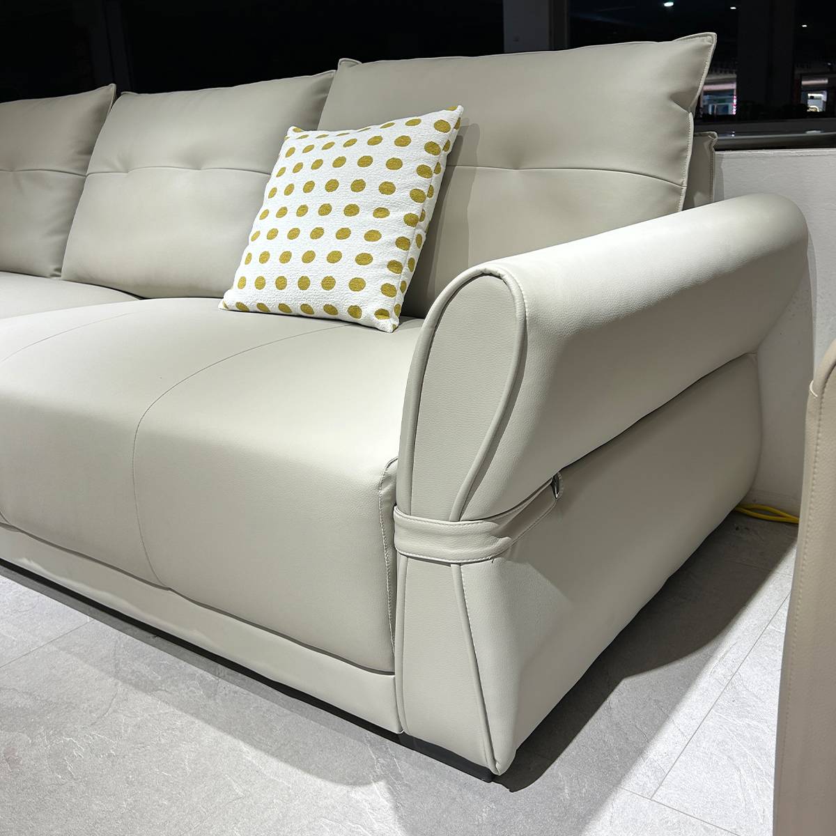 Close-up detail of the sofa armrest and seat cushion