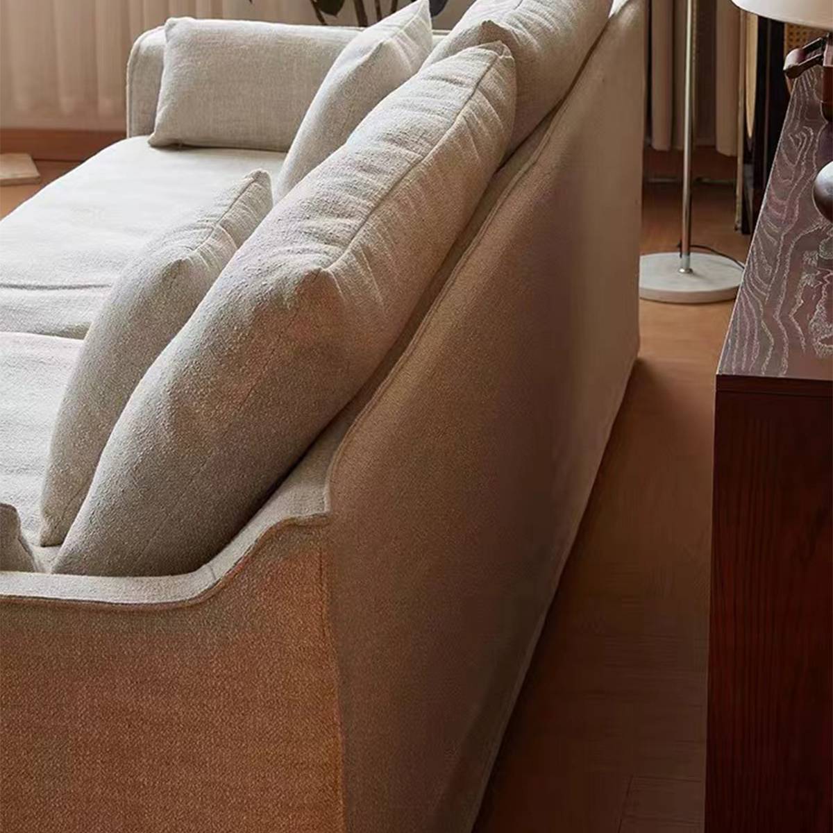 Close-up detail of the sofa armrest and back cushion texture