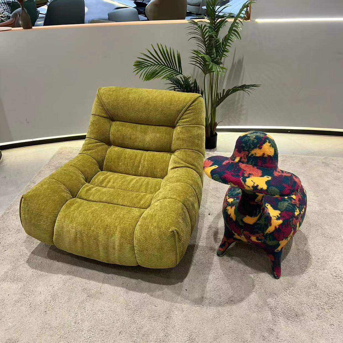 Green plush fabric swivel lounge chair front view