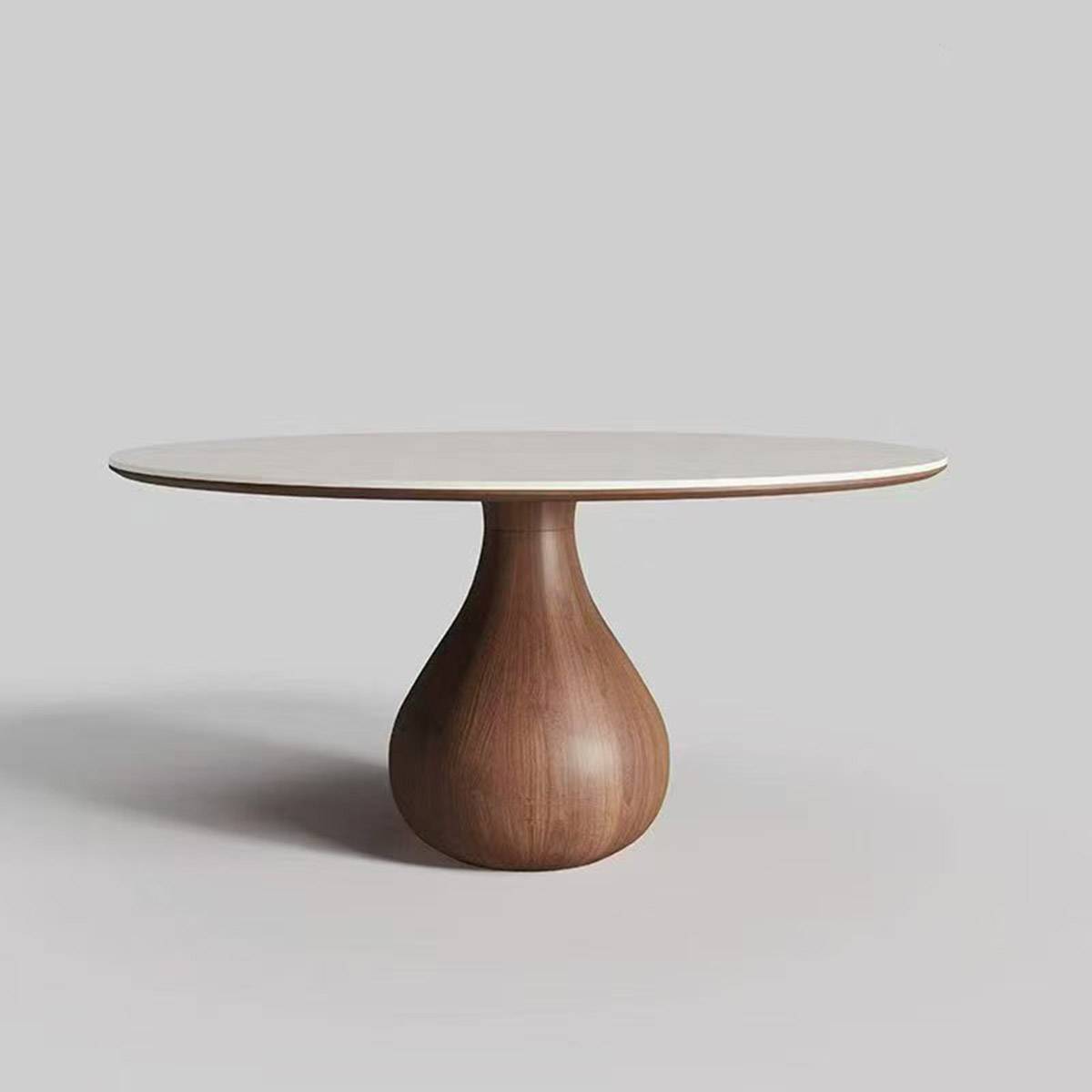 Side view of round dining table with white sintered stone top and walnut wood base