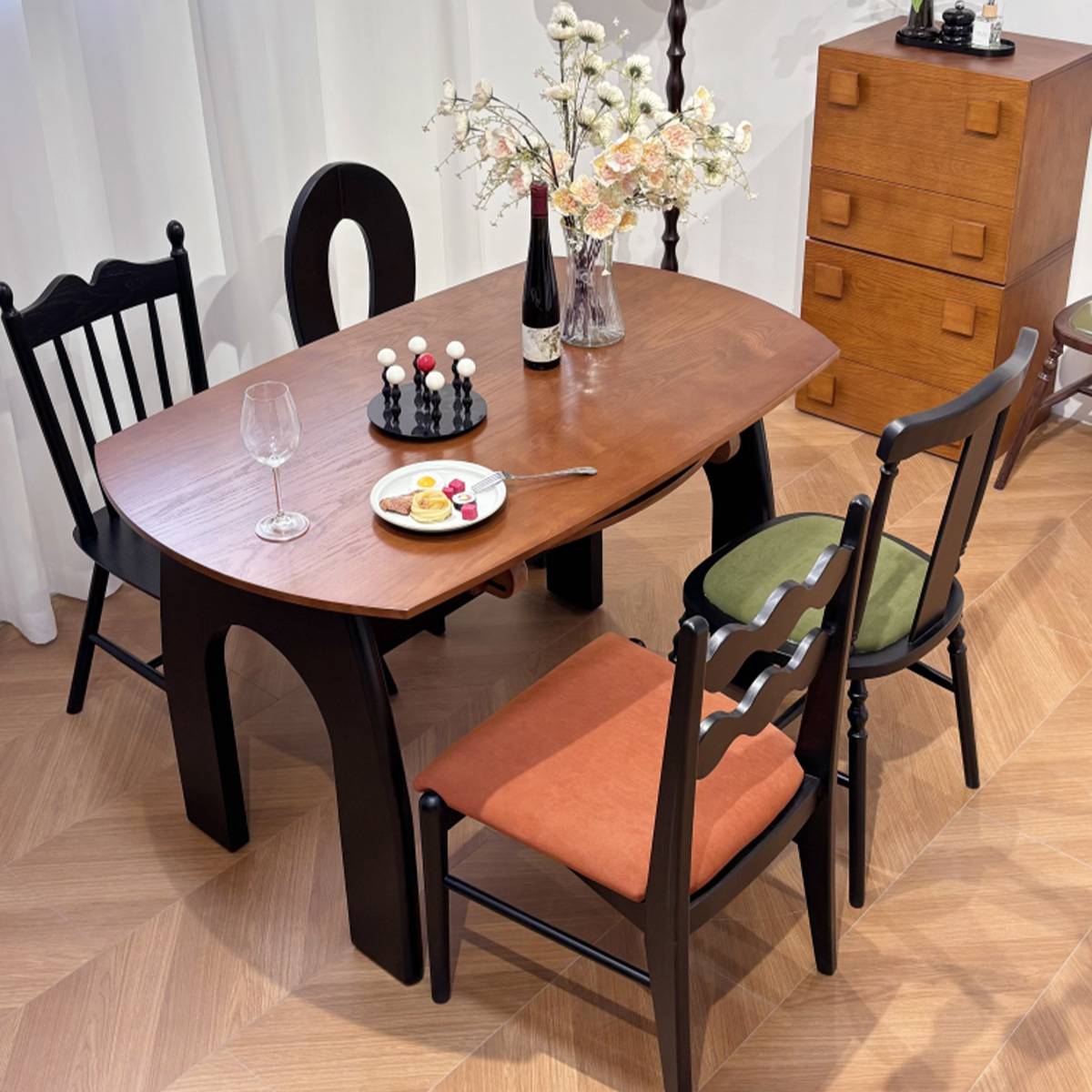 High angle view of the dining table showing the arch leg design