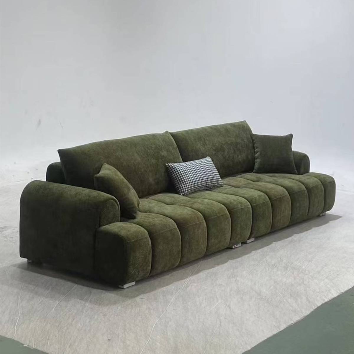 Green A72 Little Puff sofa in a studio setting