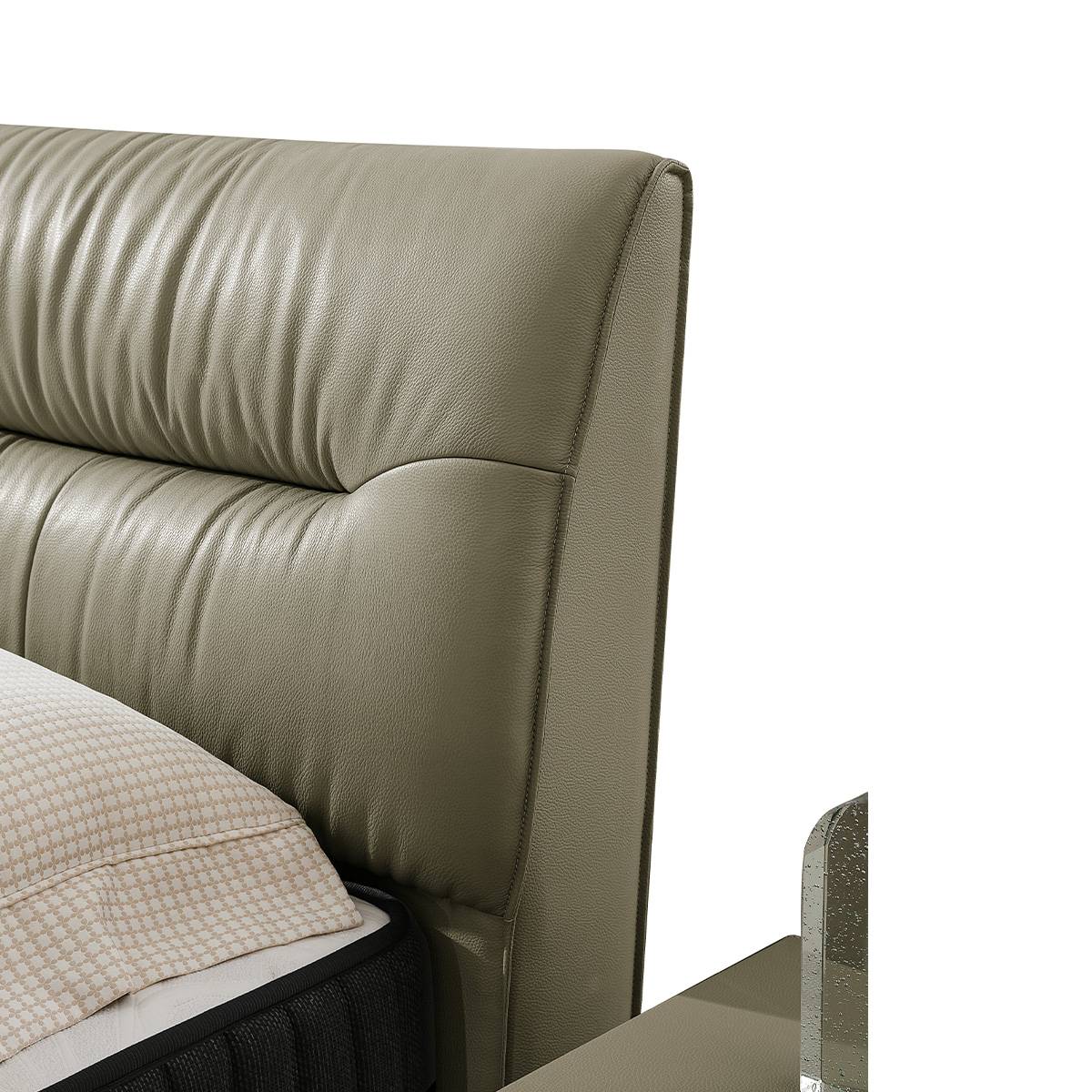 Close-up detail of the tufted leather headboard