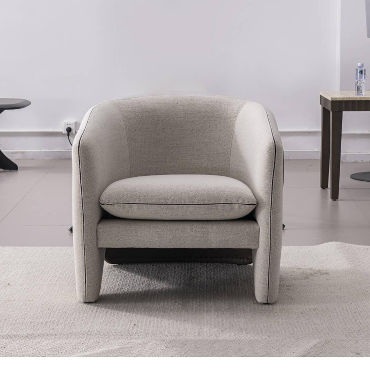 Front view of a modern beige and dark brown lounge chair