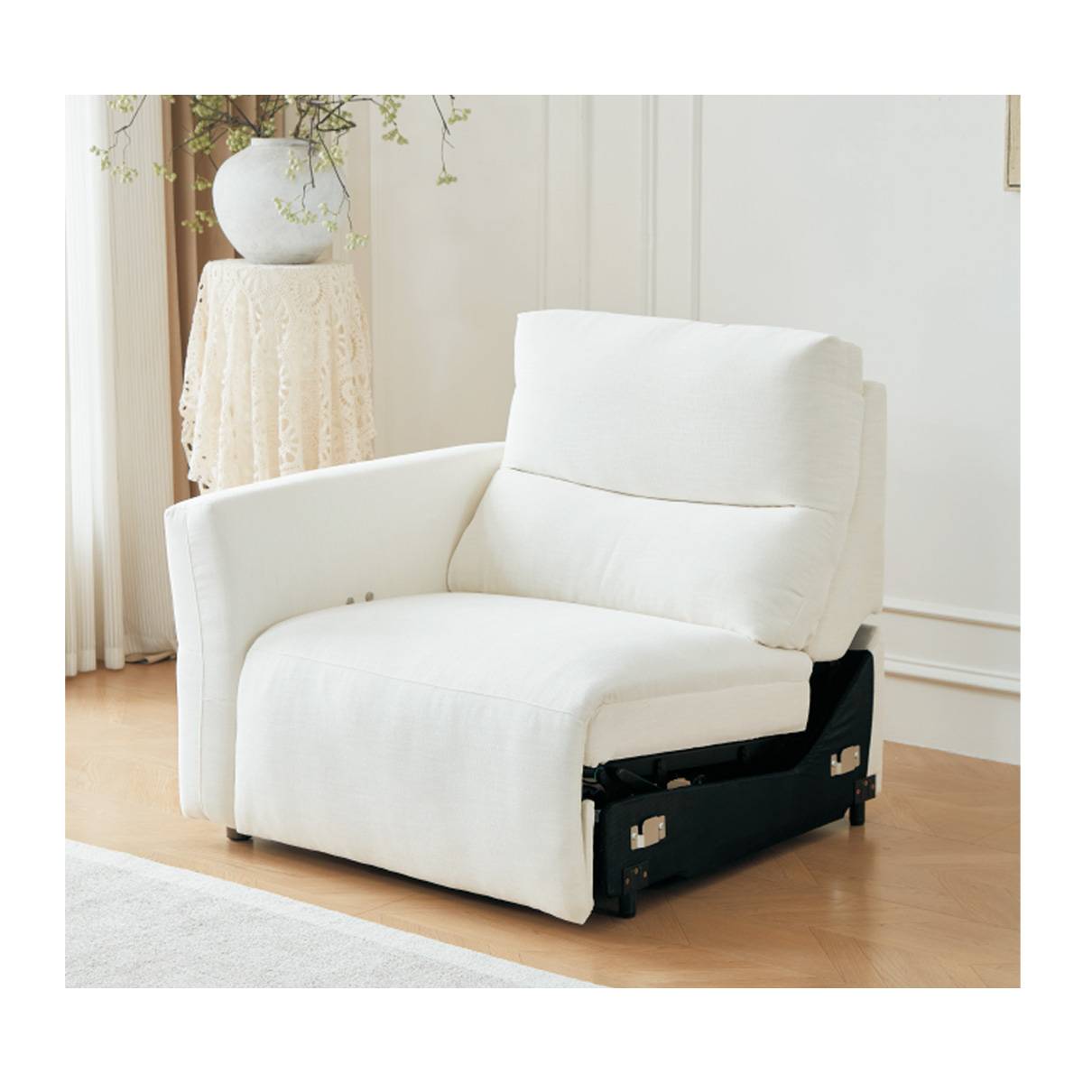Close-up of the white fabric recliner mechanism and seat cushion
