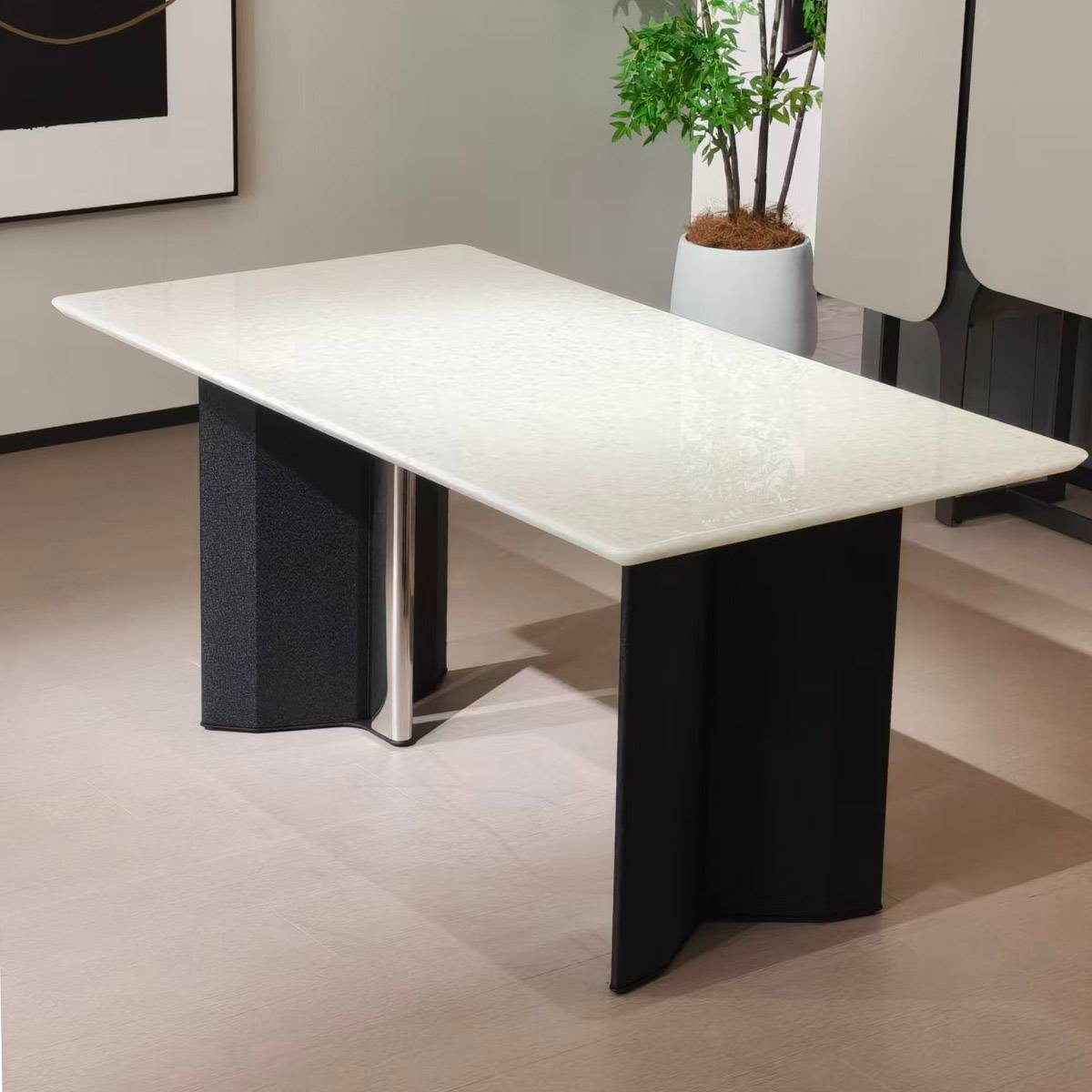 Close-up of the table surface and base in a showroom setting
