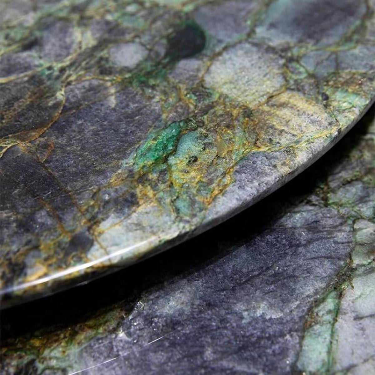 Close-up detail of the emerald marble texture and edge