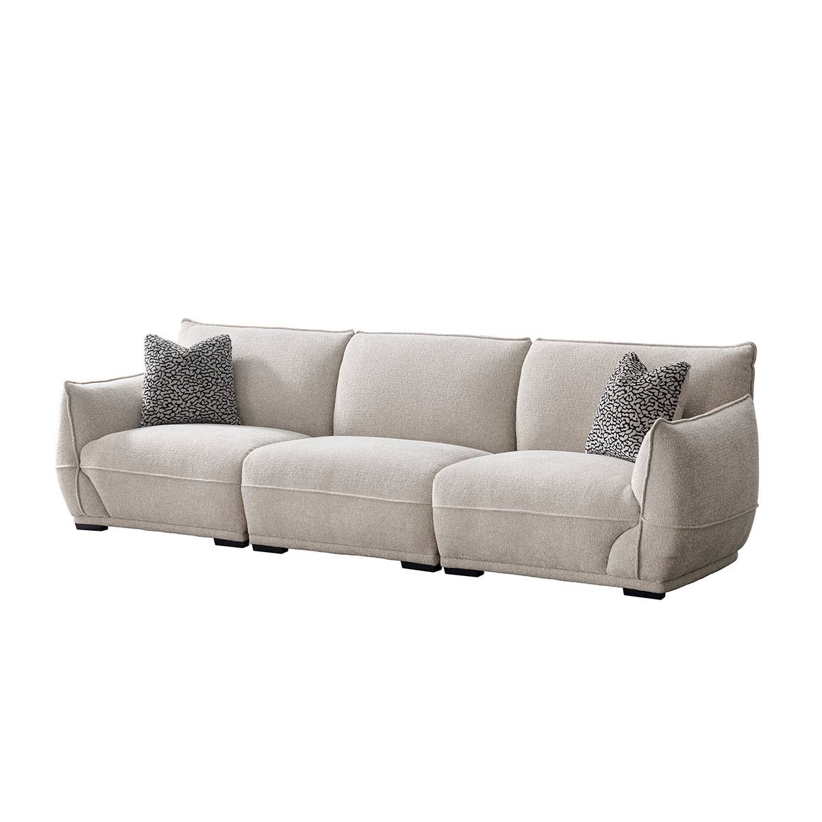 Angled view of a beige fabric sofa