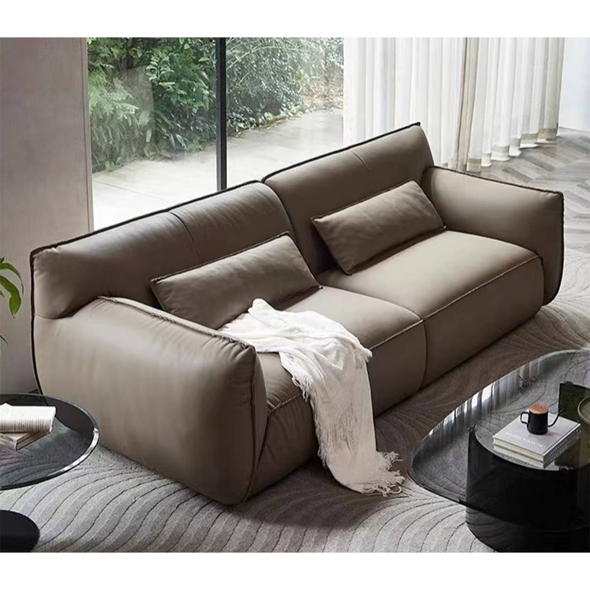 Angled view of a beige eco-leather sofa in a living room setting with a throw blanket