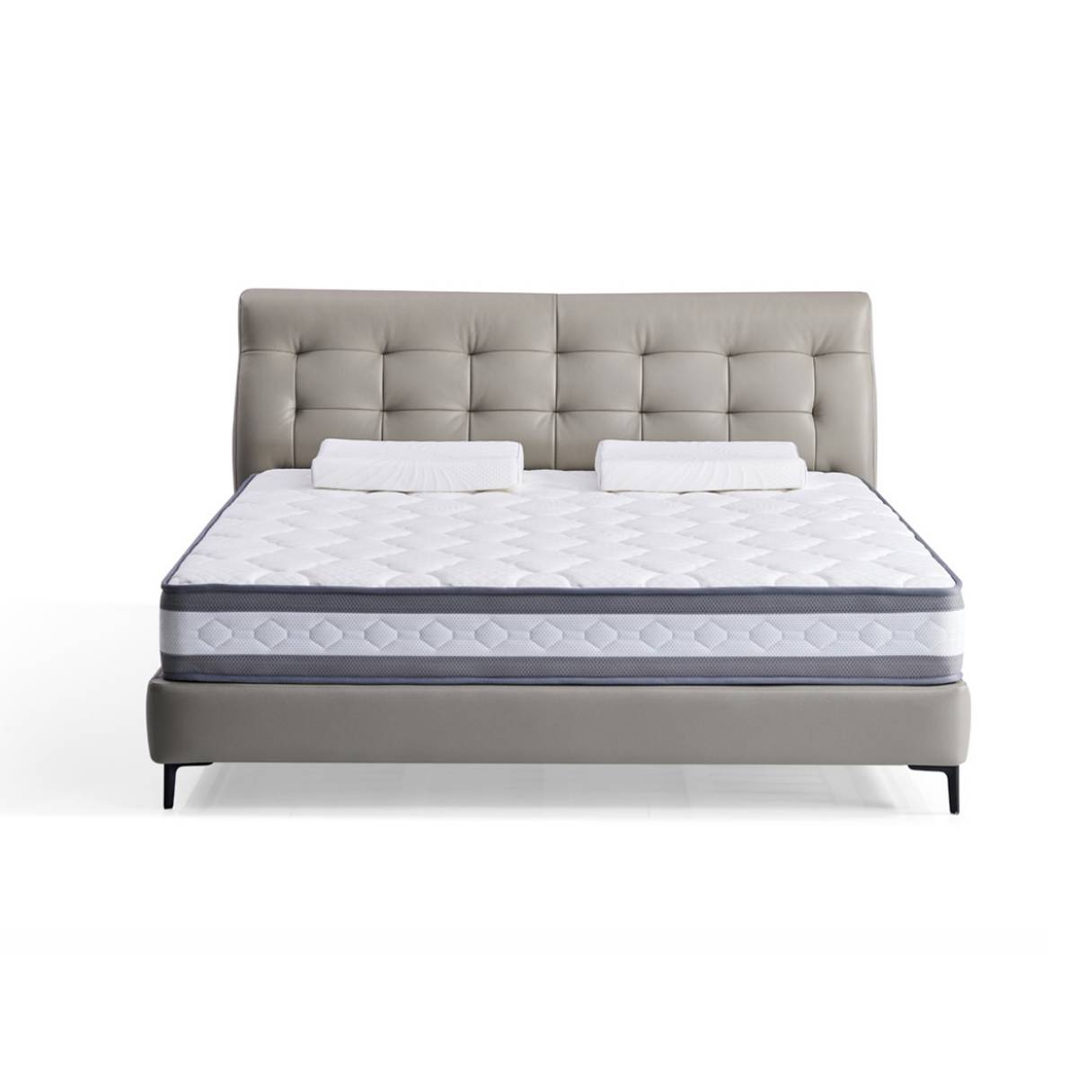 Front view of a grey tufted leather floating bed with a white mattress and two pillows