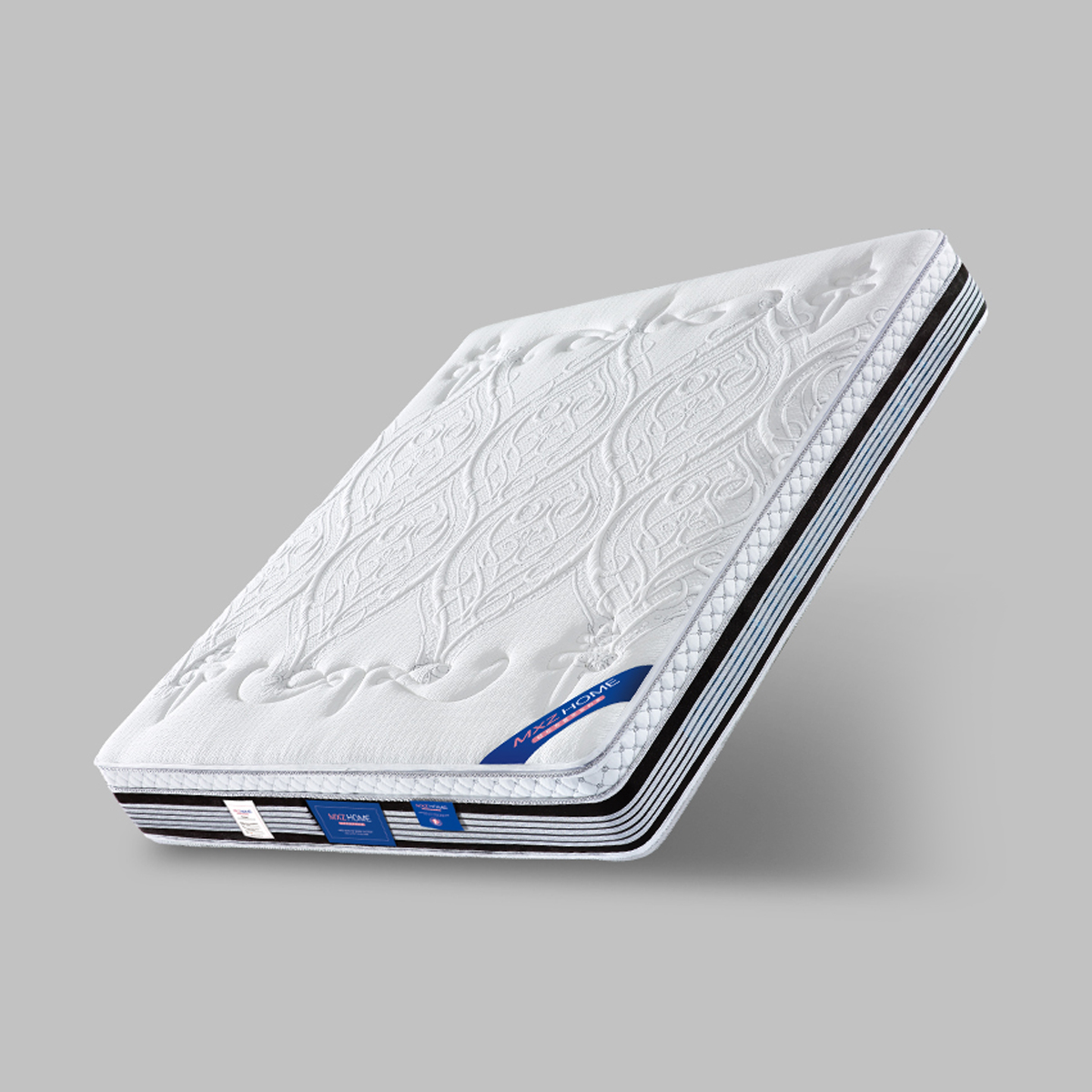 Angled view of the mattress showing the MXZ HOME branding and side layers