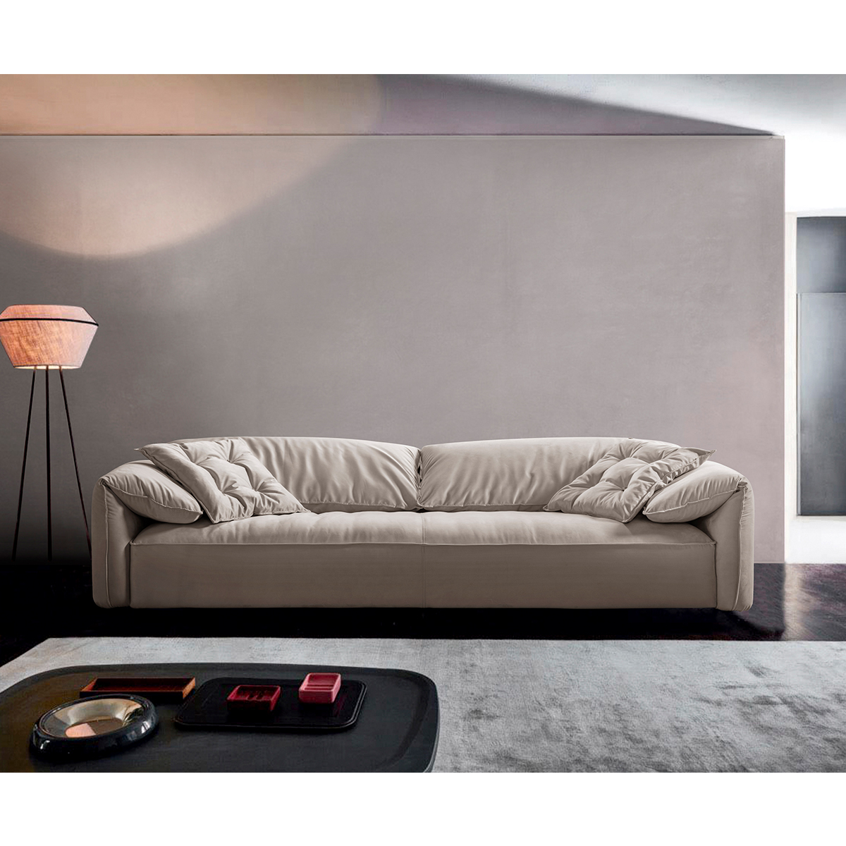 Side view of the beige sofa showing the rolled armrest and seat cushion