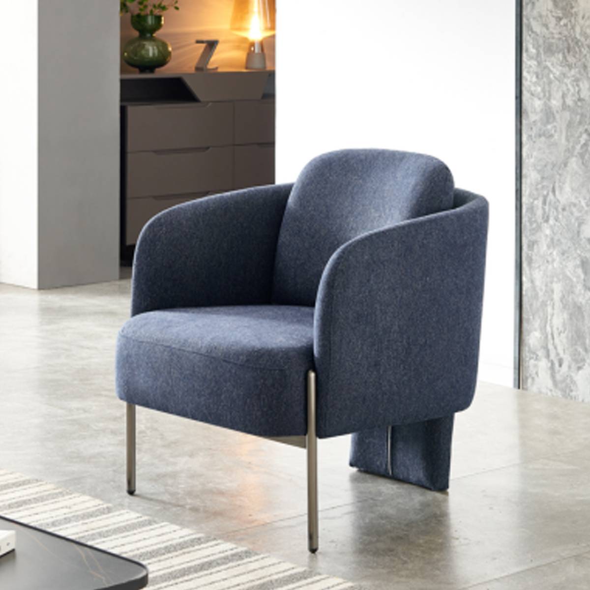 Side view of blue modern lounge chair showing rear support block