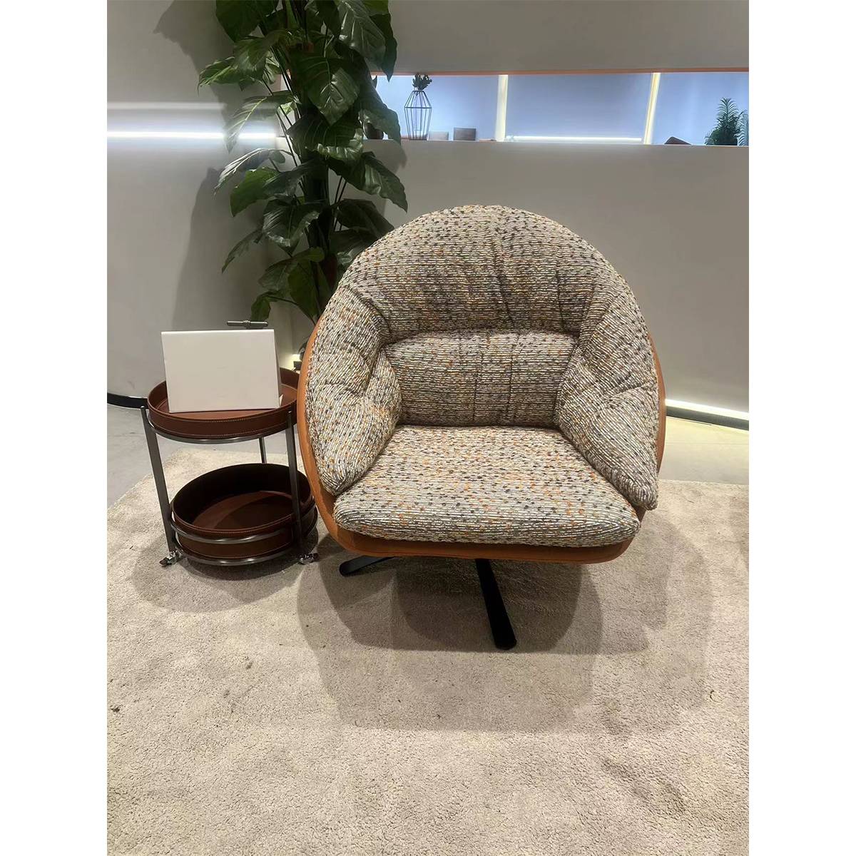 Multi-colored speckled fabric swivel lounge chair