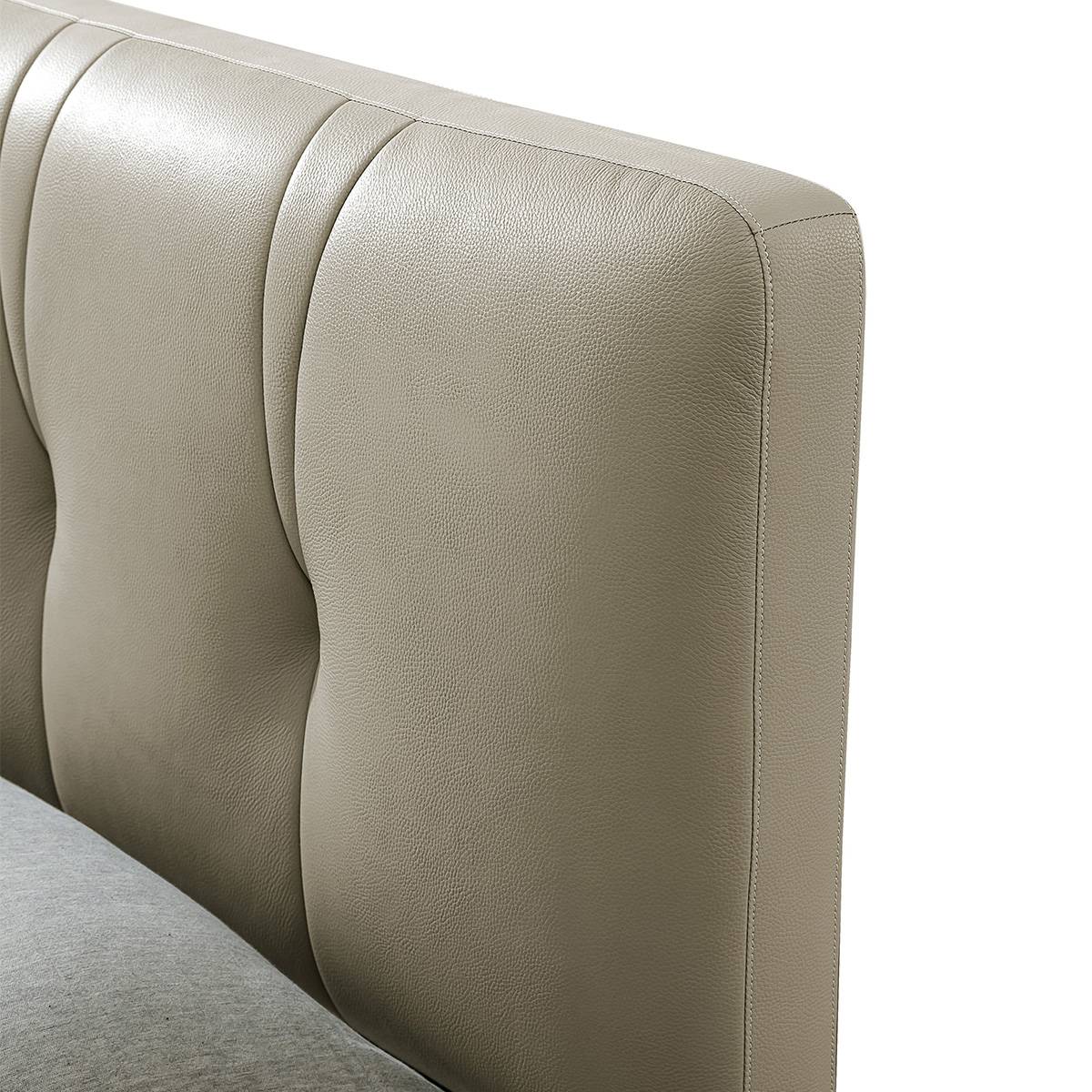 Close-up detail of the tufted leather headboard texture