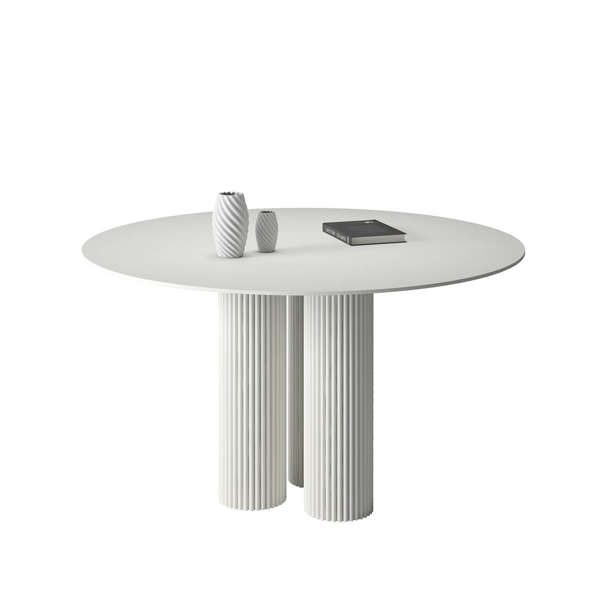 White round dining table with fluted legs and vases
