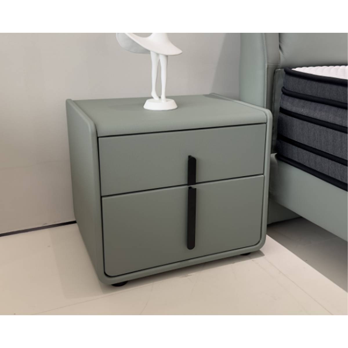 Bedside cabinet placed next to a bed in a bedroom setting