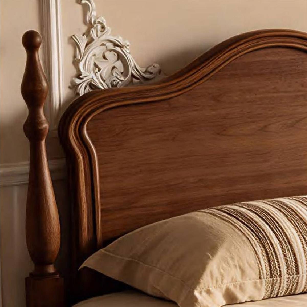 Detail shot of the turned wooden post and the top curve of the headboard