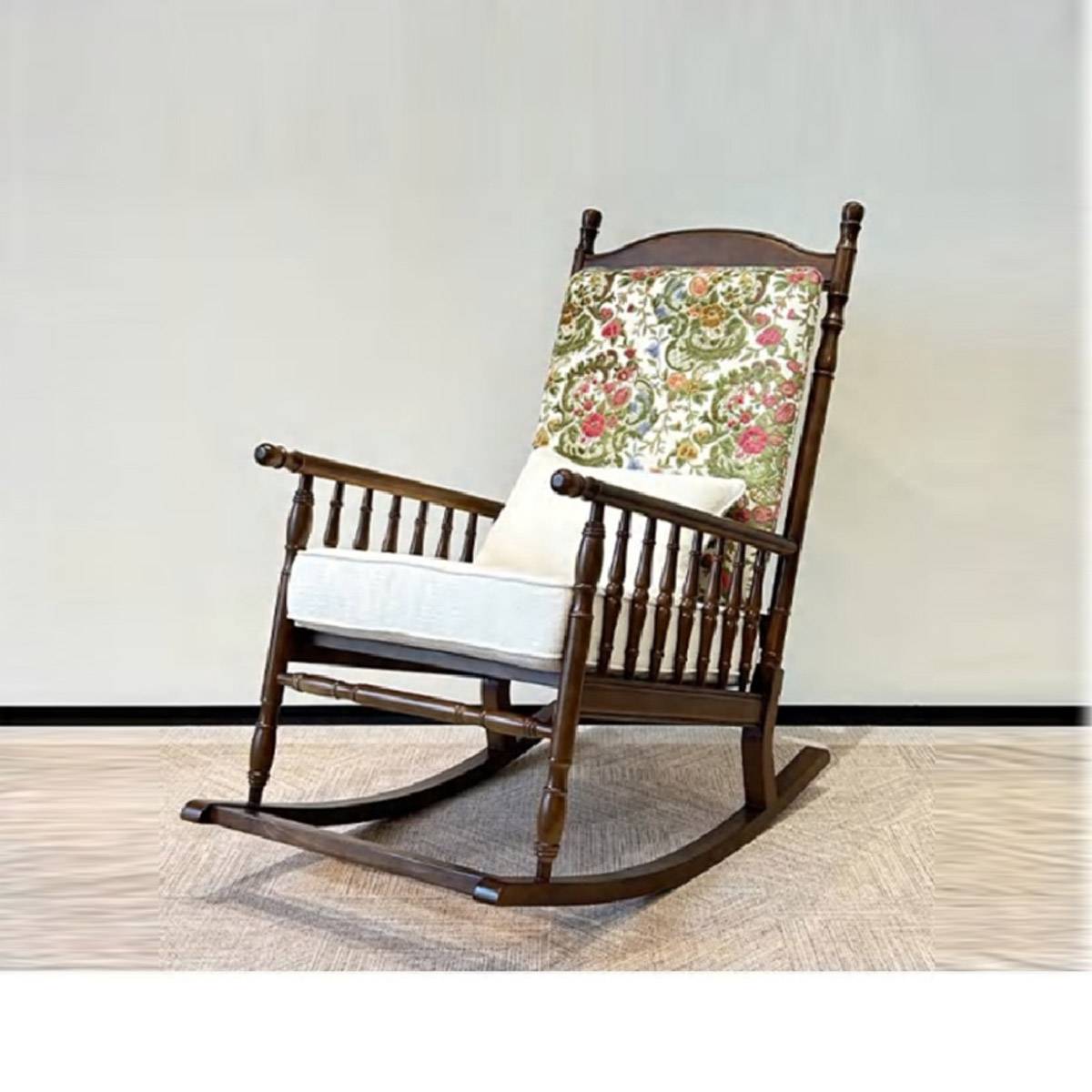 Side view of the vintage rocking chair showing the wooden frame and cushion