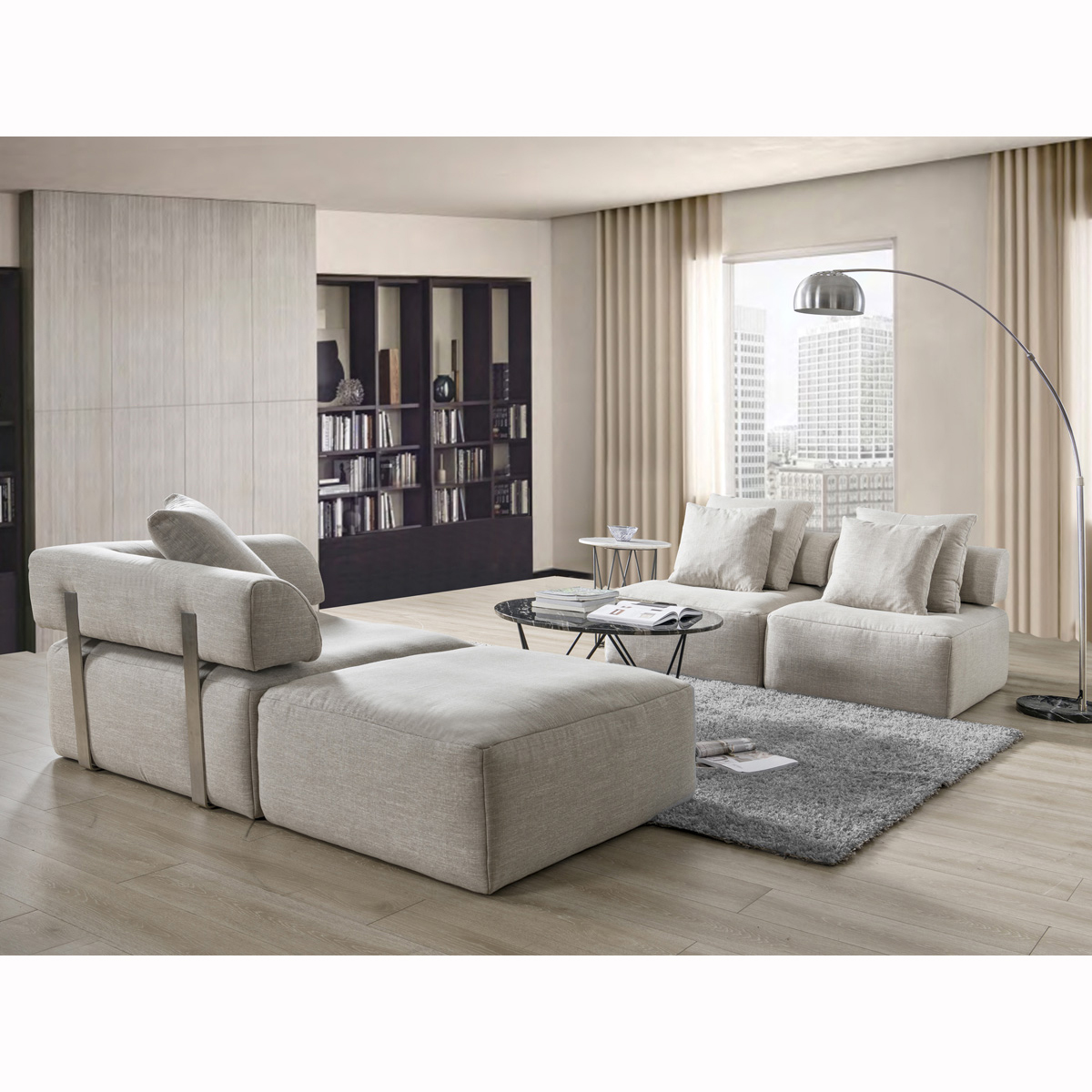 Side view of the modular sofa setup, highlighting the ottoman's position and design.