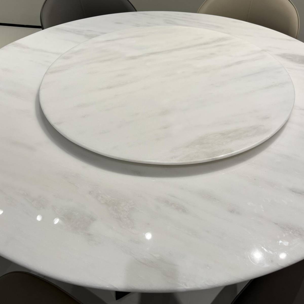 Close-up detail of the marble tabletop and turntable