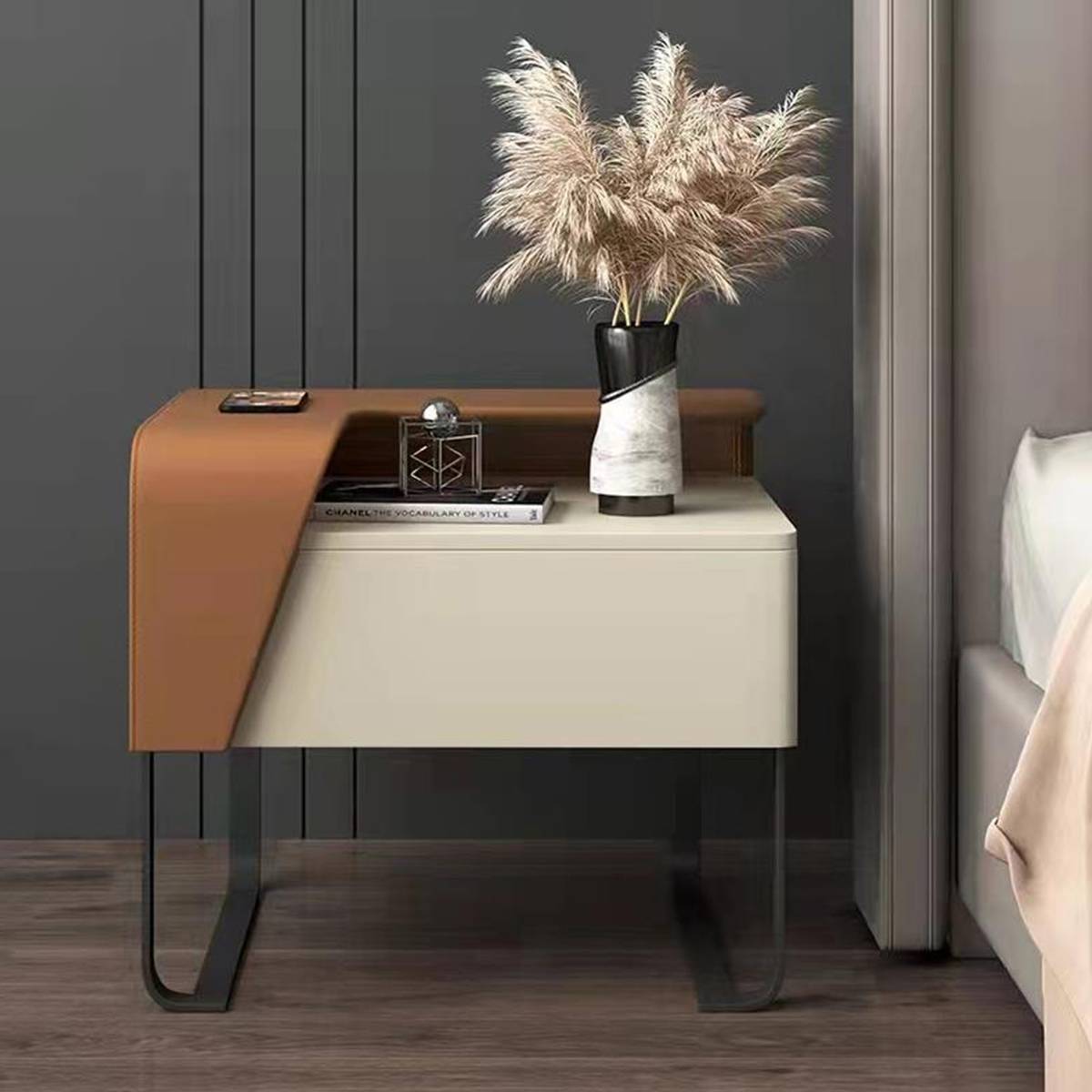Orange and cream asymmetrical bedside table with black metal legs