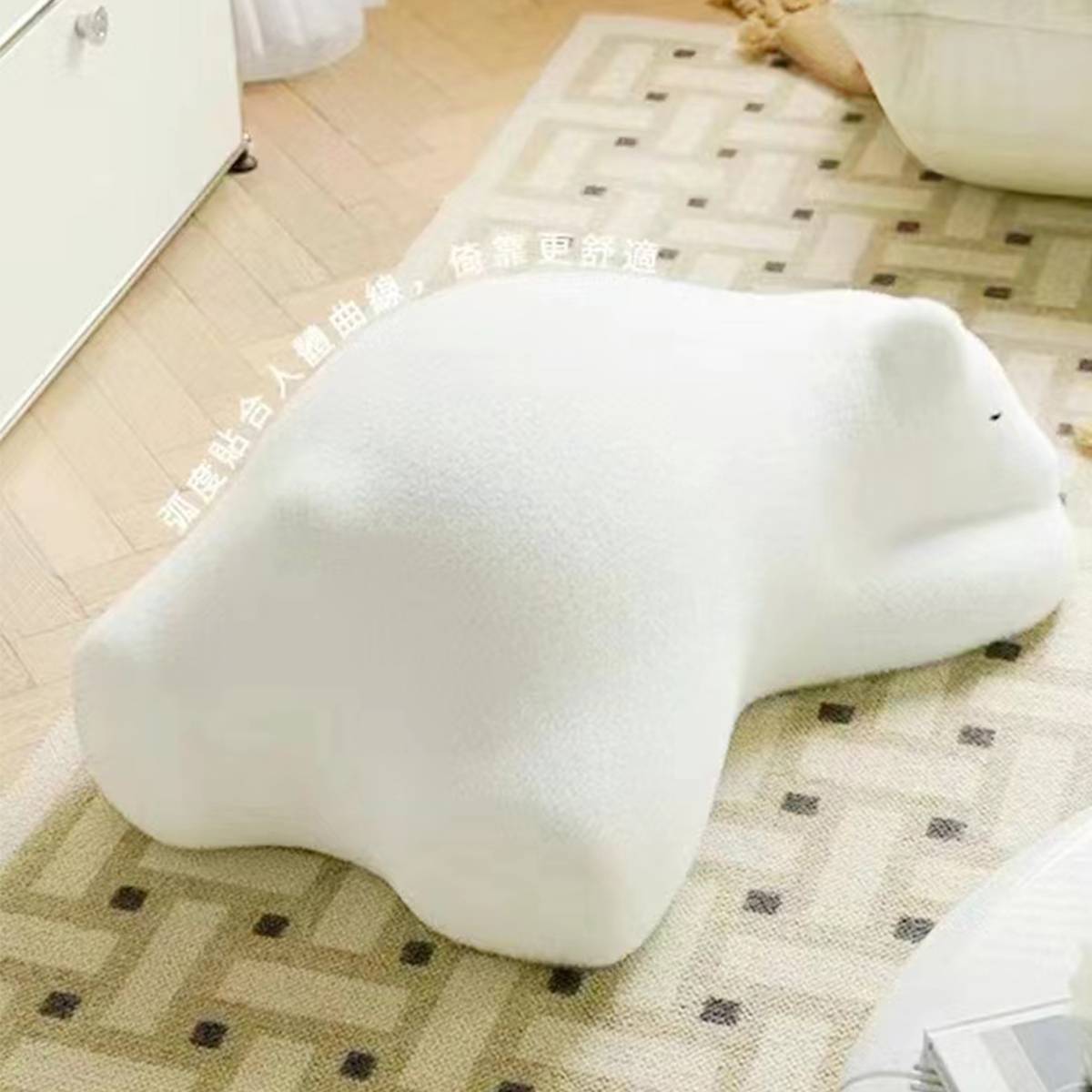 Side view of the white bear stool showing ergonomic curves