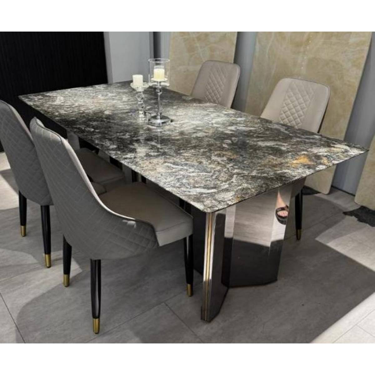 Side view of the Platinum Diamond dining table showing the thick stone edge and pedestal base