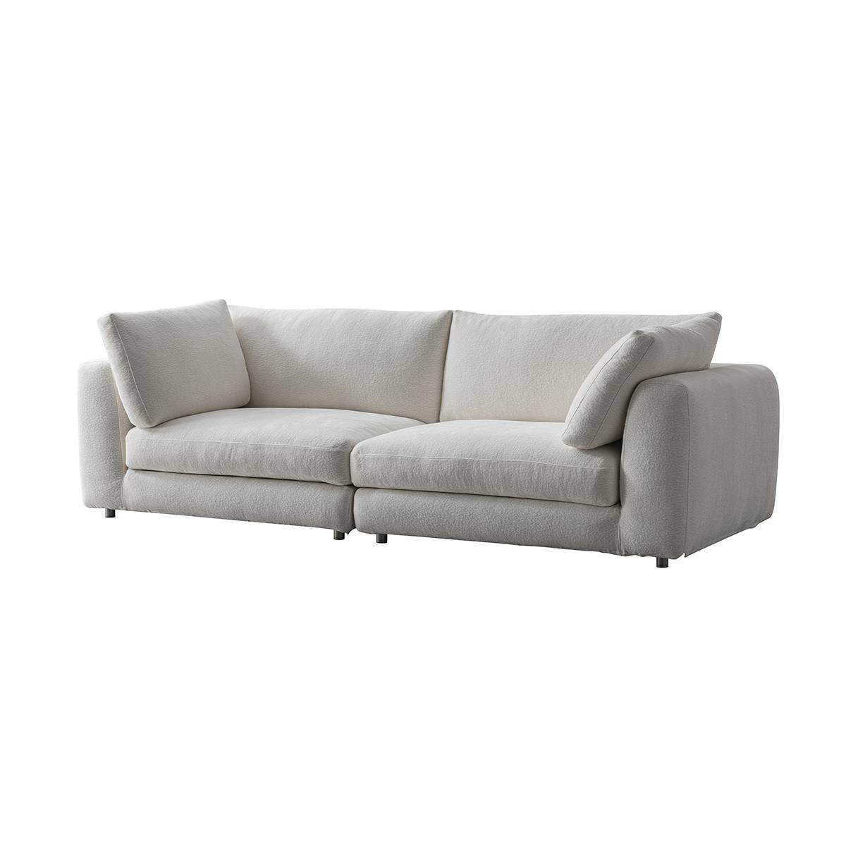 Three-quarter view of the white fabric sofa against a white background.
