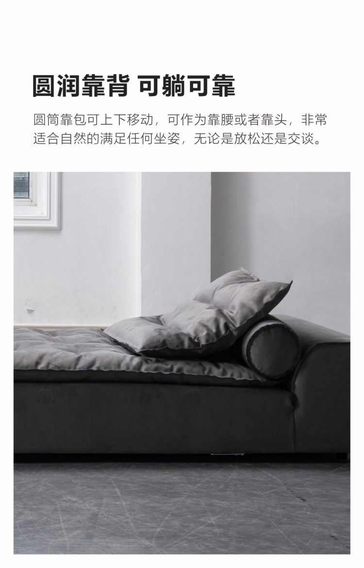 Side view of the sofa showing the rounded backrest and adjustable cylindrical bolster.