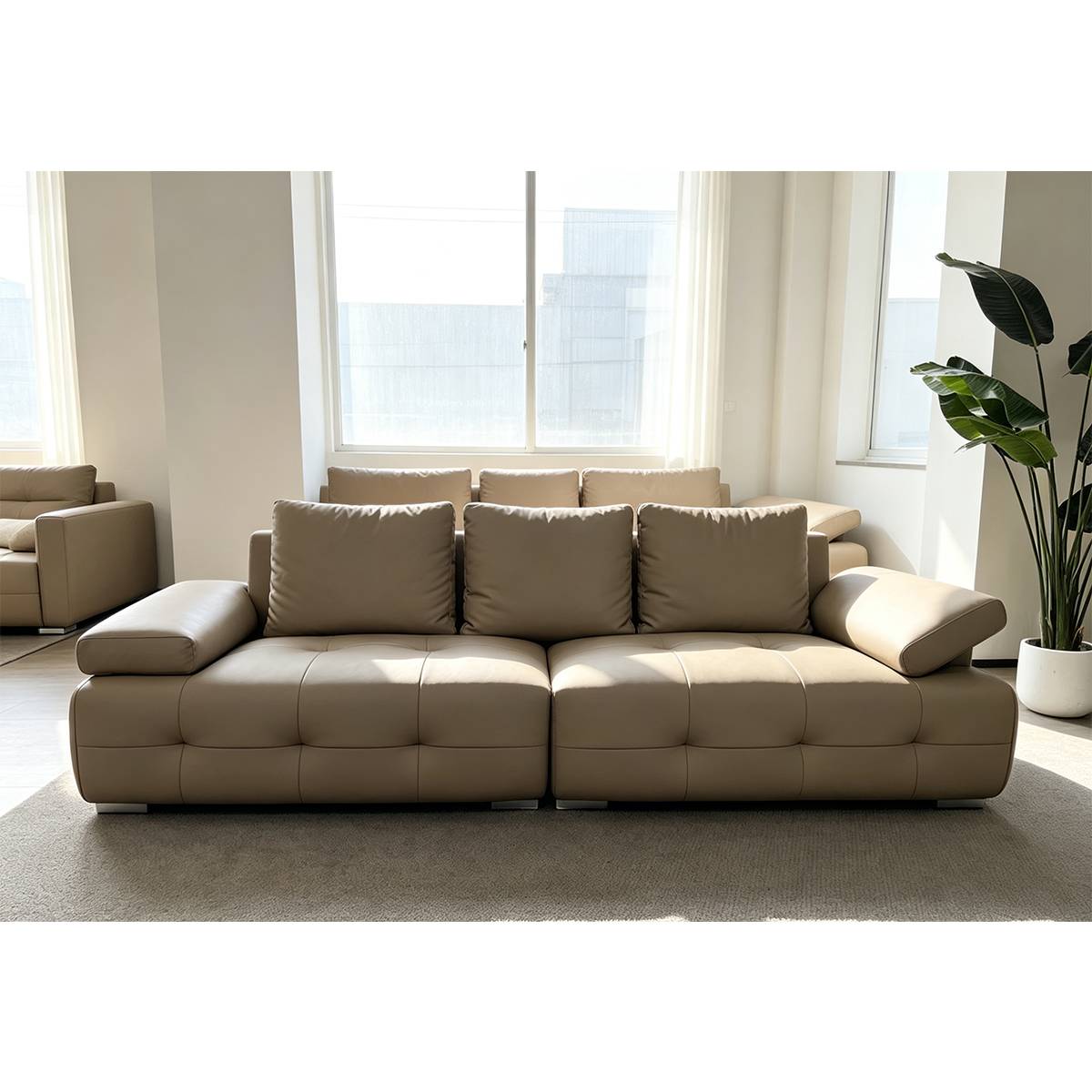 Front view of the beige eco-leather straight sofa in a bright room with large windows.