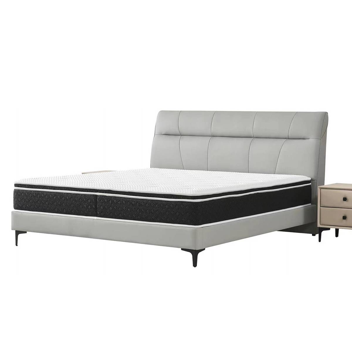 Light grey upholstered bed with tufted headboard and black legs