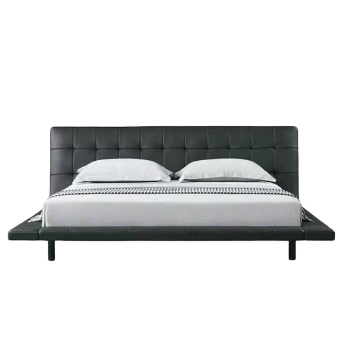 Front view of the black leather tufted platform bed with white bedding