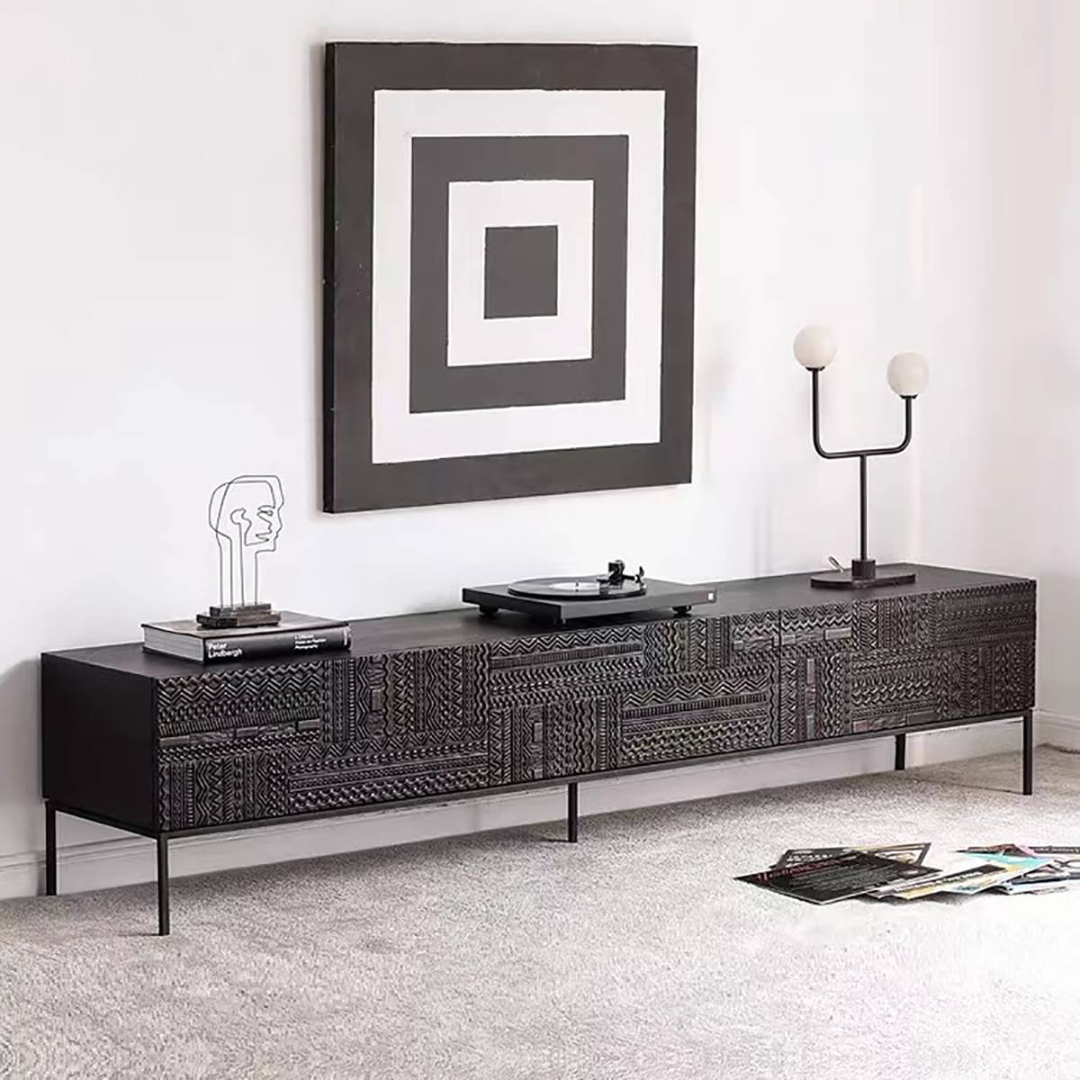TV console styled with a record player and abstract art