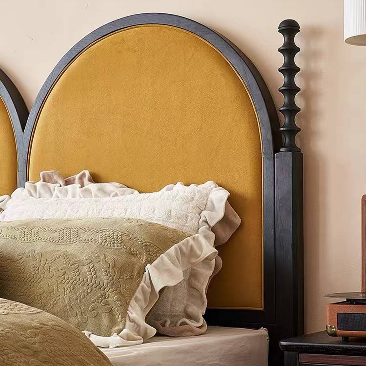 Detail view of the double-arched headboard design