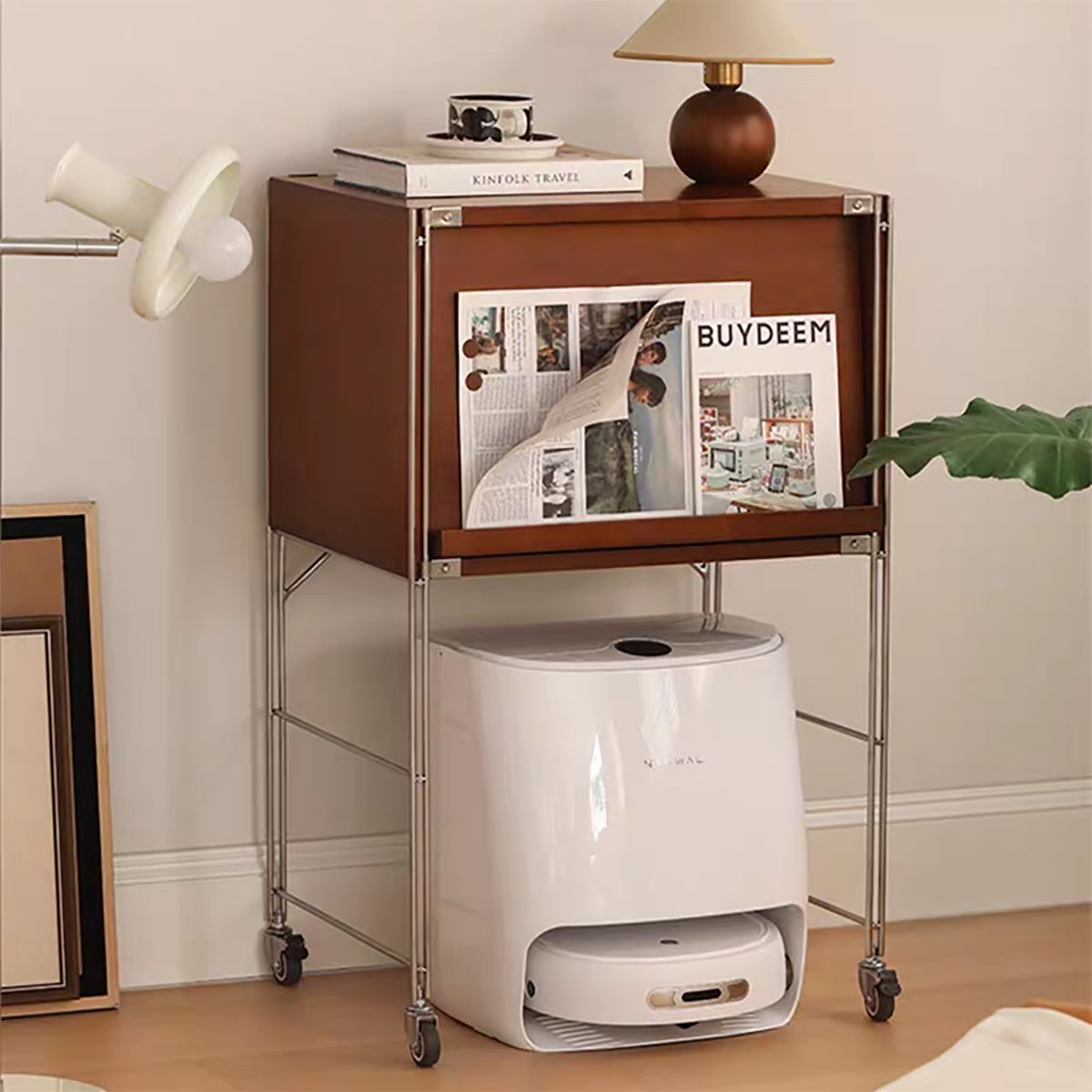 Close-up of the cabinet with books and lamp on top