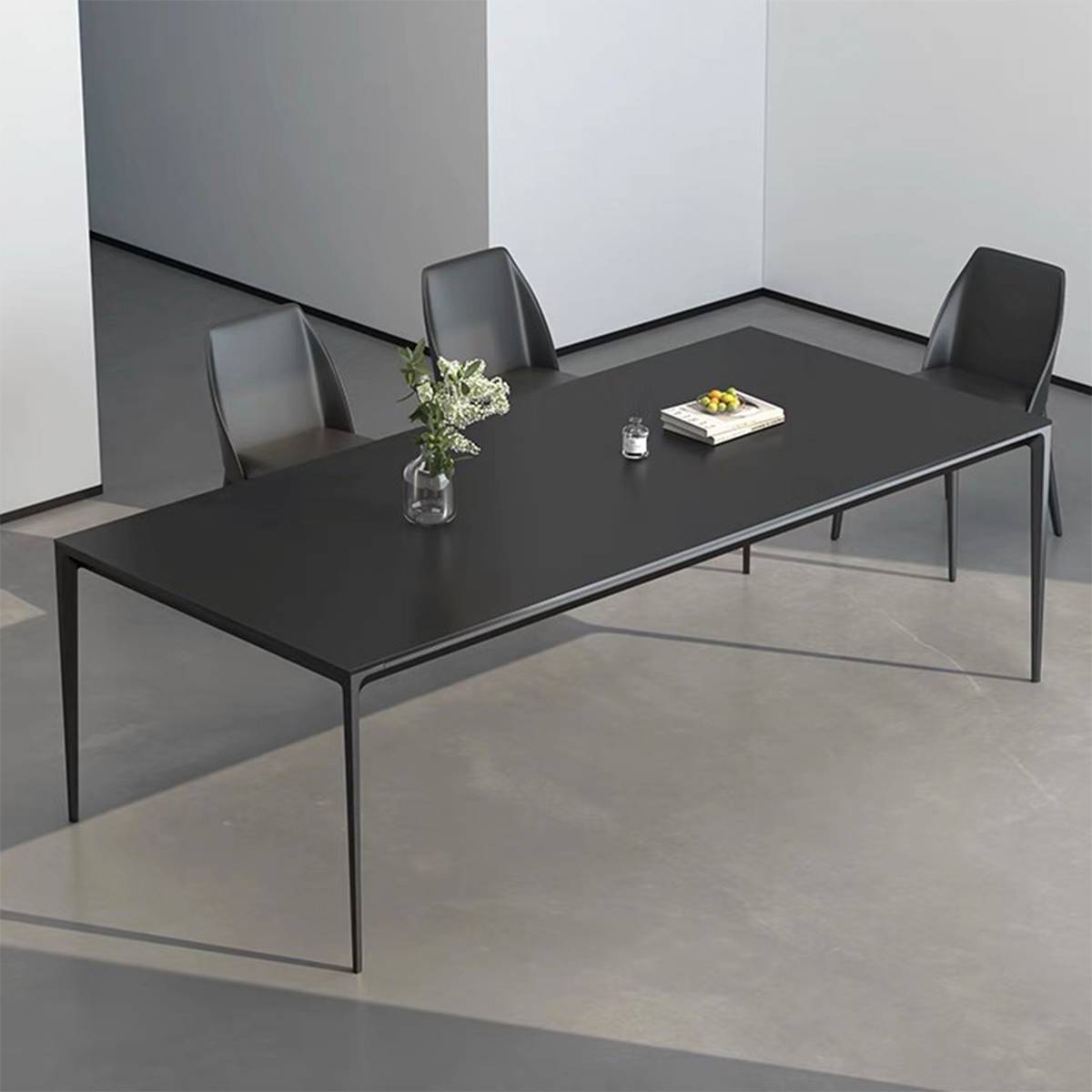 Black dining table with straight legs and black chairs