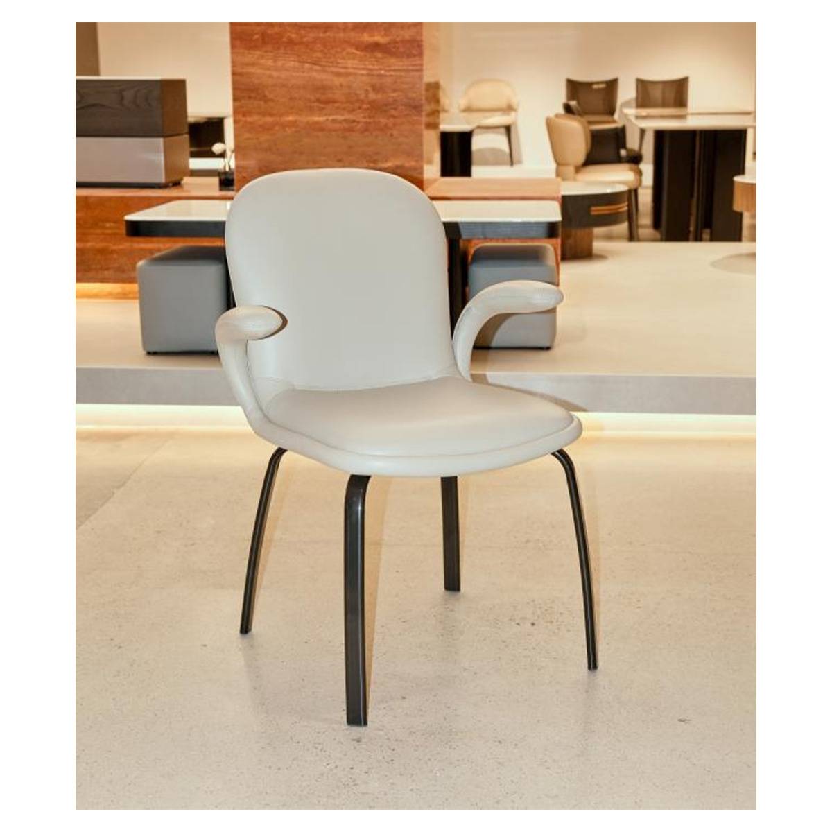 Beige modern dining chair with curved back and metal legs