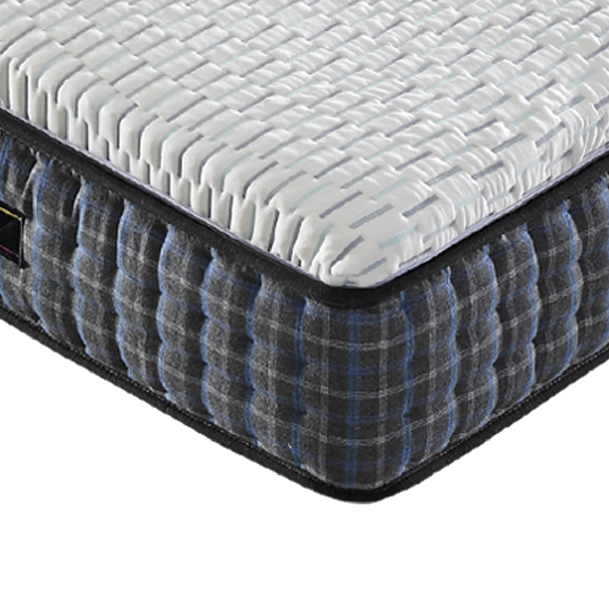 Close-up view of the mattress corner showing the white textured top surface and blue plaid side fabric