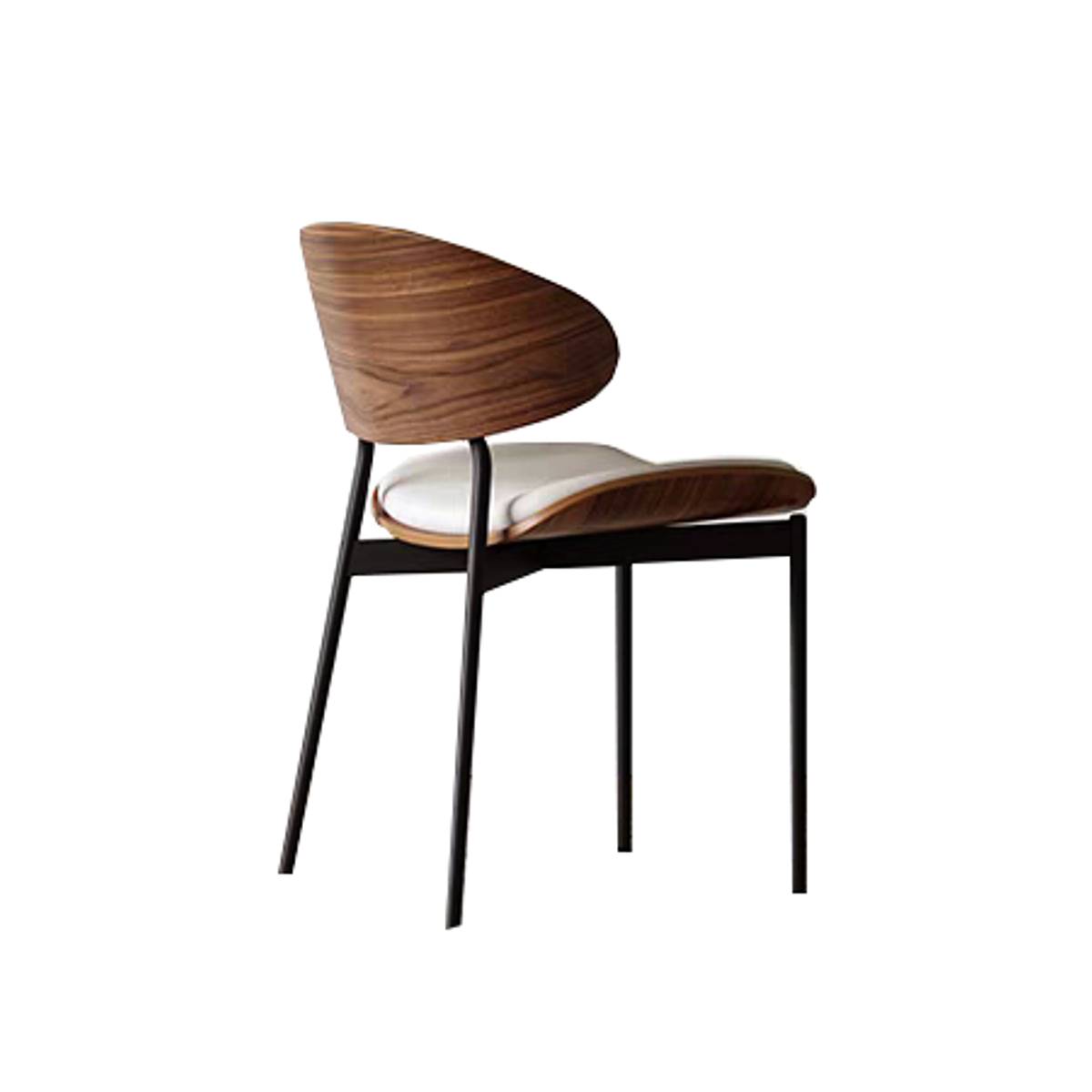 Rear view of an off-white mid-century dining chair showing the wooden backrest