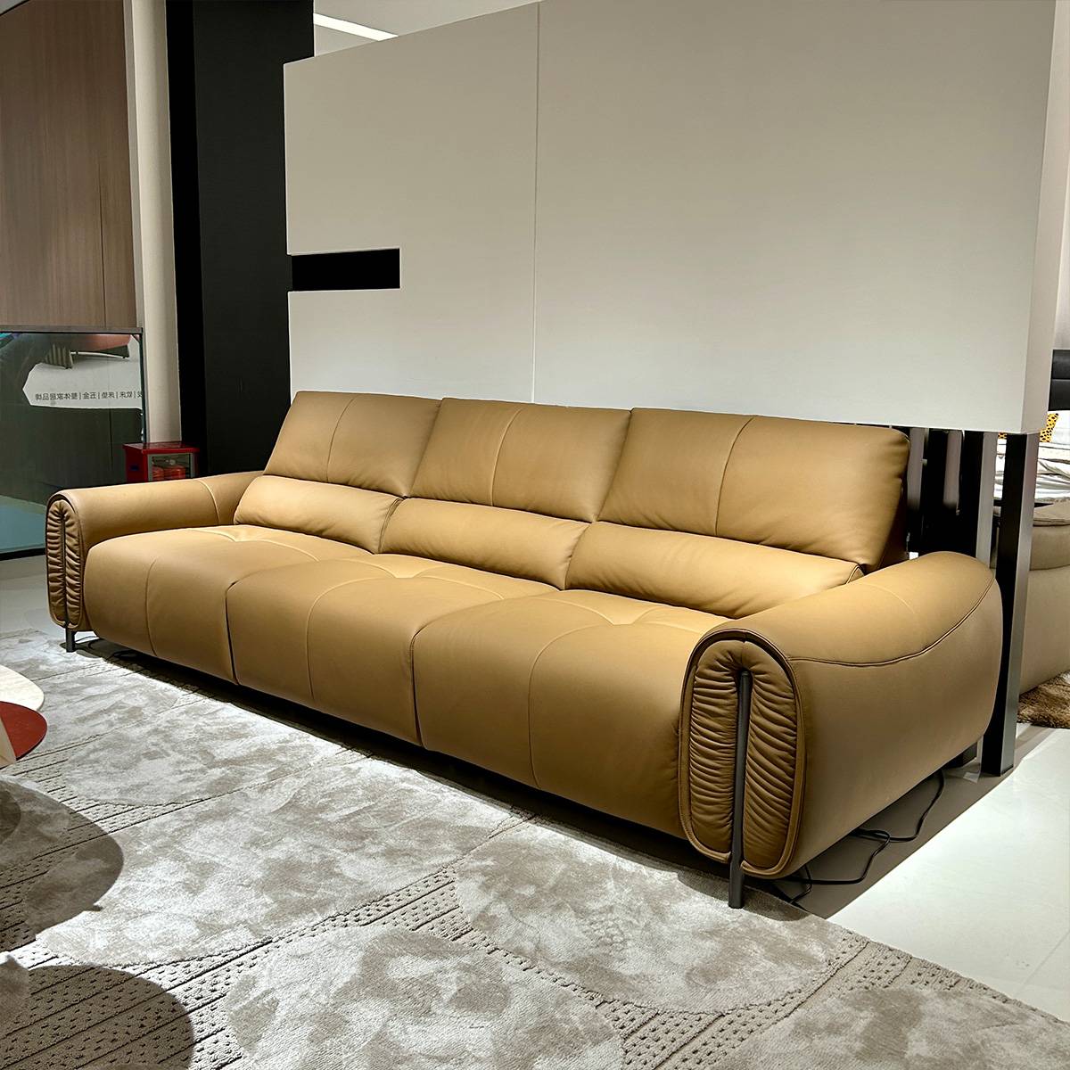 Opposite side angle view of the sofa in a showroom setting