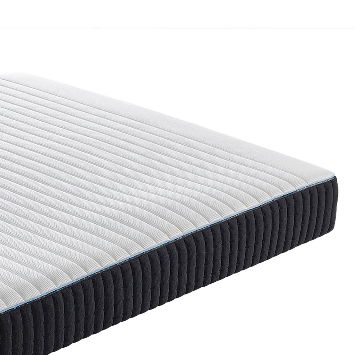 Close-up of the mattress edge showing the blue trim and fabric texture
