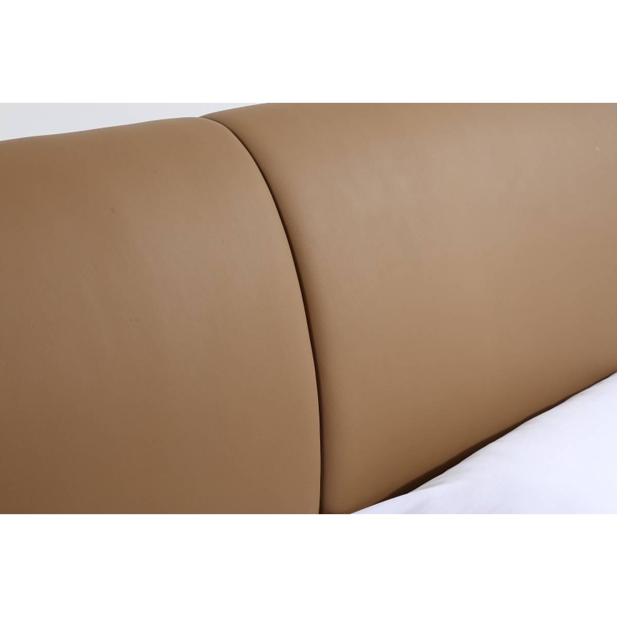 Close-up detail of the brown leather headboard panels