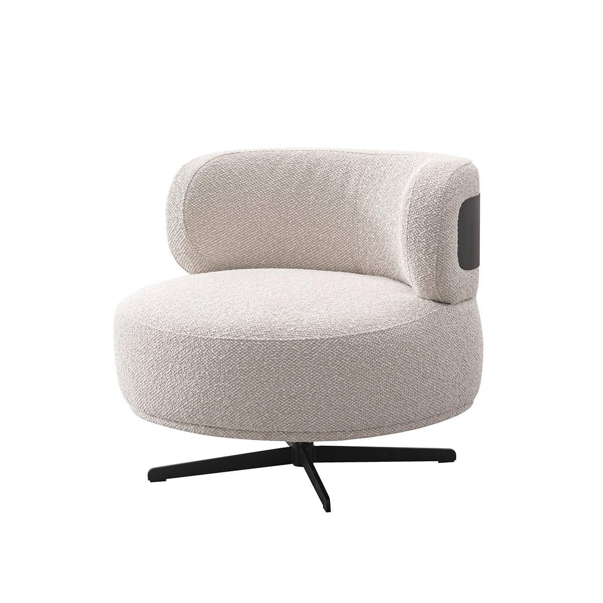 Side view of beige swivel lounge chair showing black leather accent