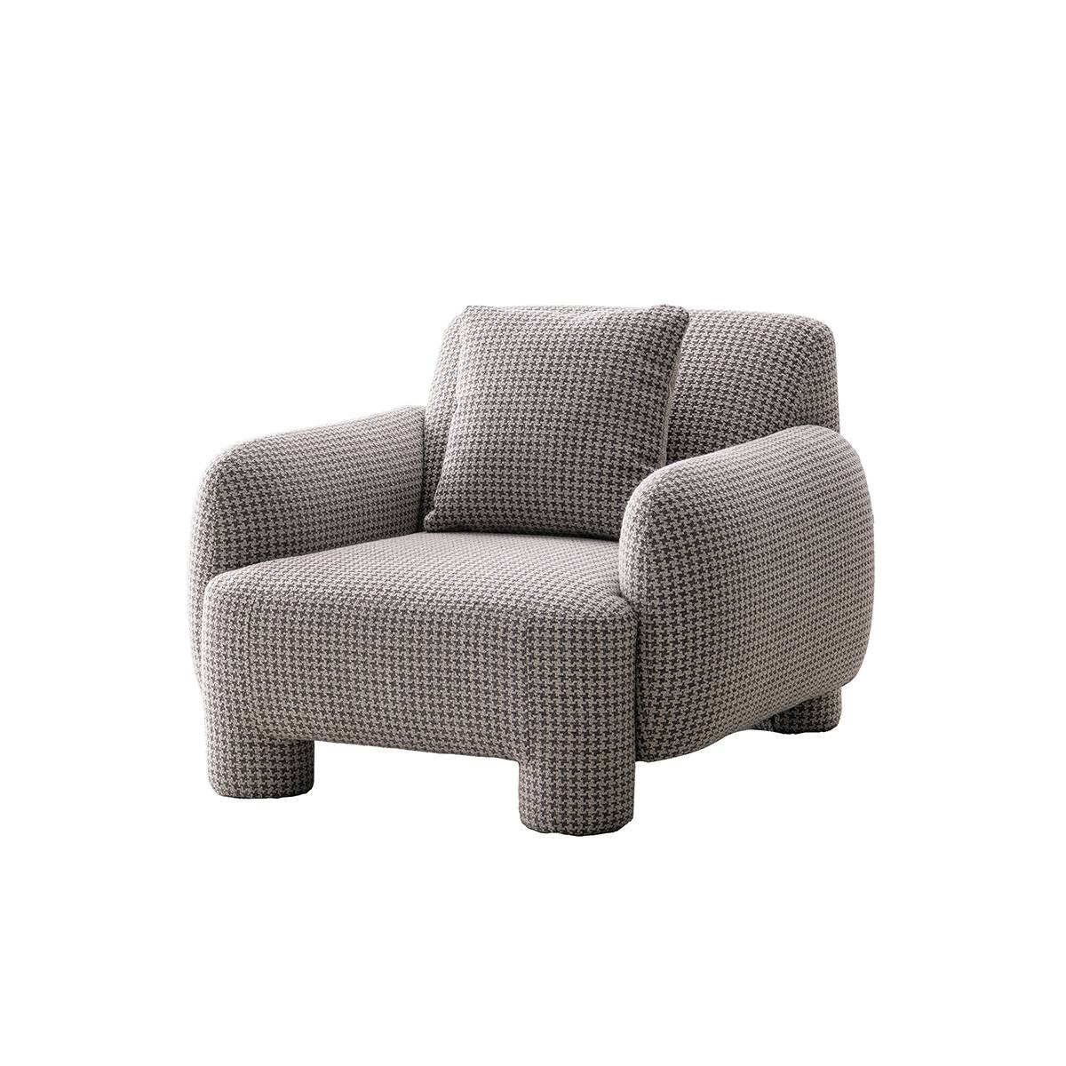 Studio shot of the matching lounge chair in houndstooth pattern fabric