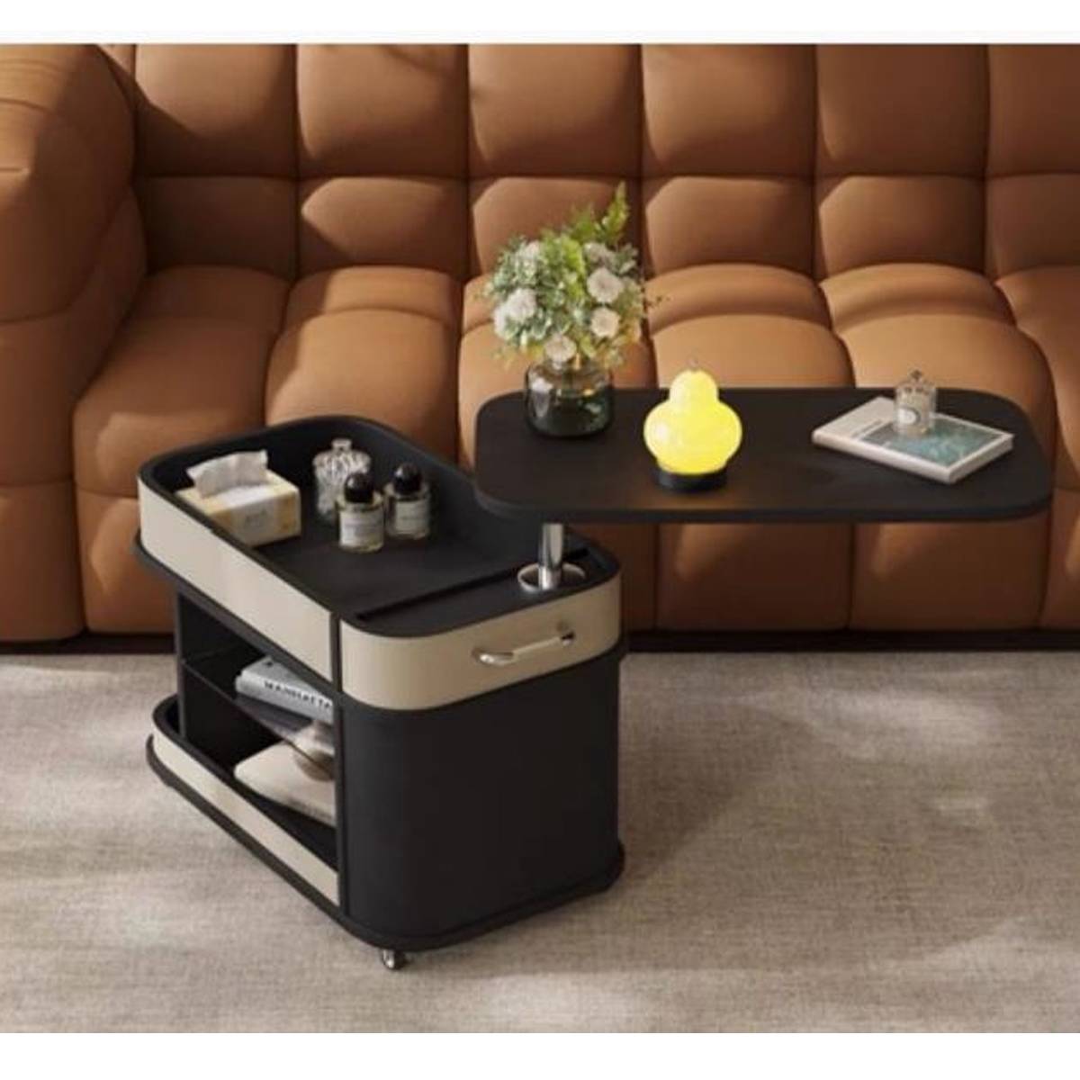 Mobile side table with adjustable height top next to a brown leather sofa