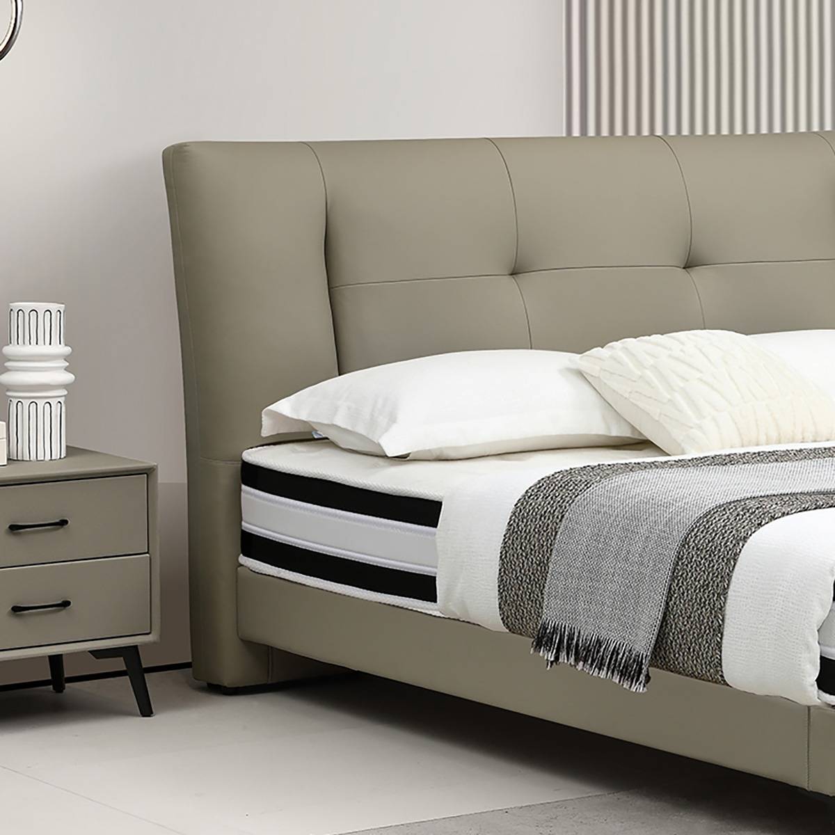Side view of the bed frame showing the mattress and bedside table.