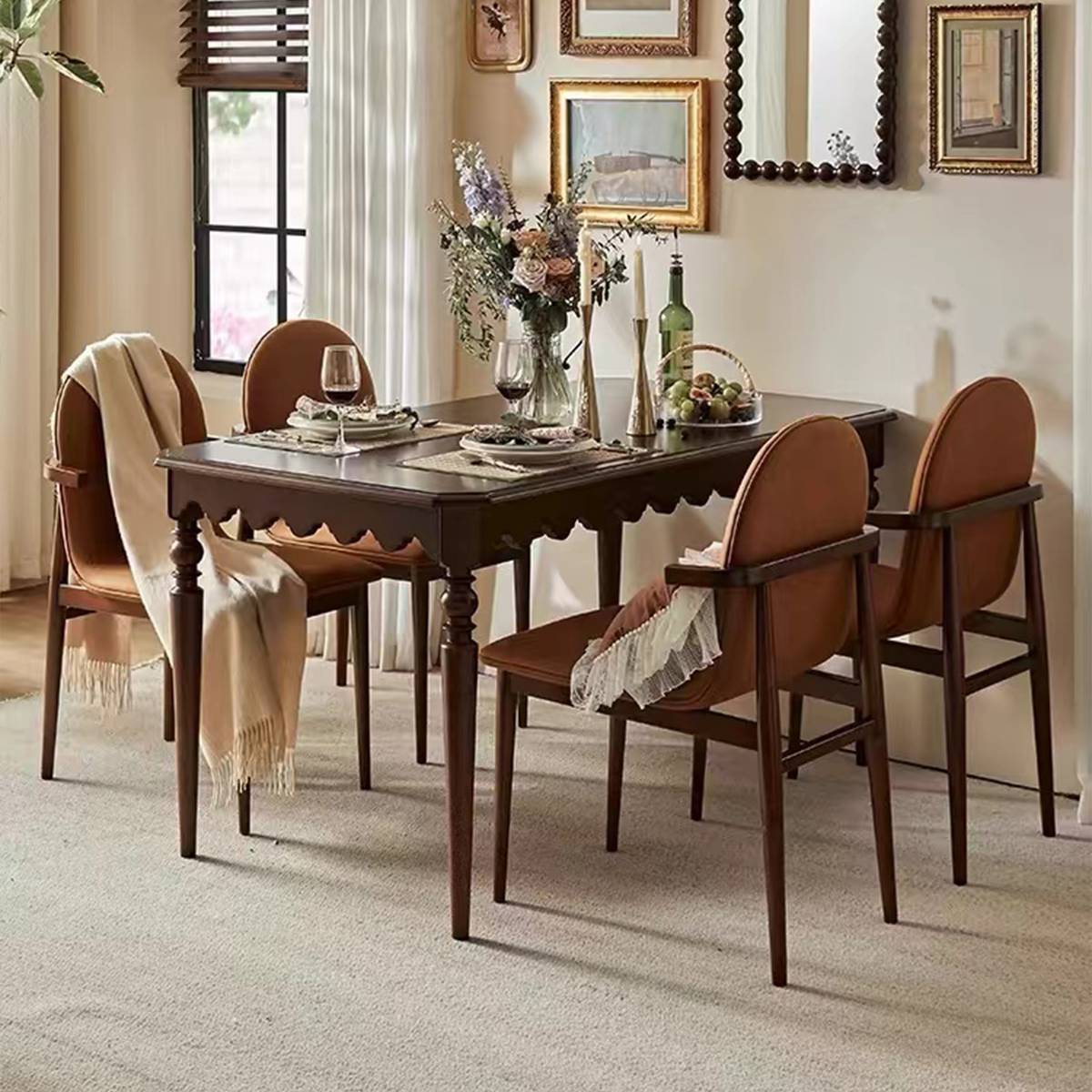Close-up of dining table with table setting and brown chairs