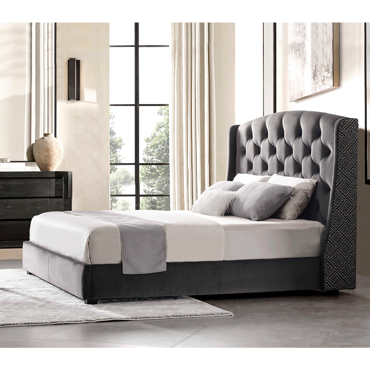 Bedroom setting showing the bed with a nightstand and window