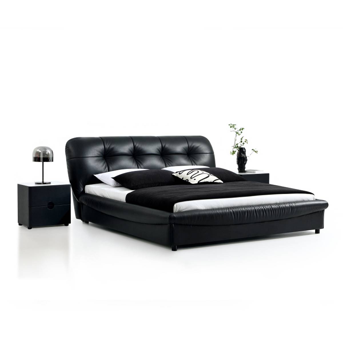 Side angle view of the black leather bed